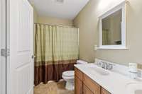 Upstairs full bath with tub/shower combo with double vanities;