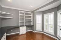 Beautiful bay windows make working from home in this office a joy.