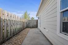 Fence back patio with storage closet