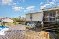 Spacious deck surrounding the pool