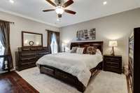 Primary bedroom with high ceilings