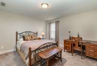 A second upstairs bedroom on the other side of the Jack and Jill bath is better suited for a Queen bed but has plenty of room left over for a dresser, bookcase, or even an executive desk.