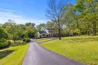 Nestled on a sprawling one-acre lot, this gorgeous Georgian is located in coveted Camelot Acres and is zoned for Percy Priest Elementary.