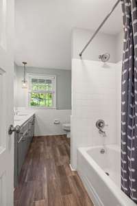 There is extra space beyond the shower tub area to add additional cabinetry or expand the shower further if desired:)