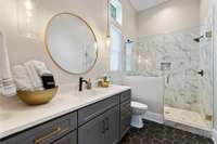 Frameless shower and custom lighting in the ensuite bath