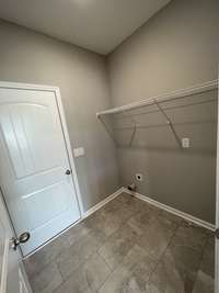 laundry room with ceramic tile floors