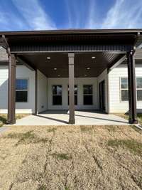 looking at the very spacious covered back porch