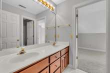 Jack and Jill bathroom with double vanity and tub/shower combo. Adjoins bedrooms #2 and #4.