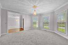 The light filled gathering room with crown molding.