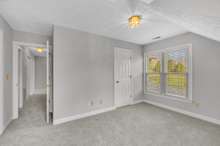 View of upstairs hallway from bedroom #4.  The hallway also has a large linen closet.