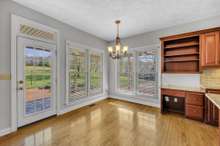 Entrance from wrap around porch to breakfast nook.