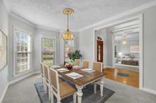 Virtually staged formal dining room.