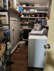 Large utility/storage area with washer/dryer hook ups off the kitchen.