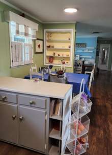 Cozy breakfast area in kitchen with built-in shelves