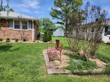 There are several sitting areas to relax in the yard, both front and back.