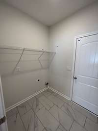 laundry room with ceramic tile flooring