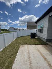 view of the right side backyard (the entire yard around the house has Bermuda sod)