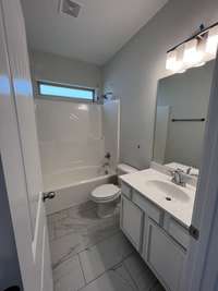 bathroom for bedrooms 2 & 3. ceramic tile flooring