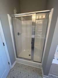 primary bathroom with shower & separate soaking tub