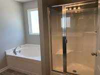 Garden soaking tub and Shower  *COLORS AND SELECTIONS VARY, HOME PICTURED IS AN EXAMPLE OF THE FLOORPLAN NOT THE ACTUAL HOME*