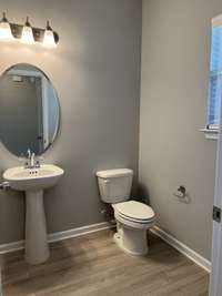 Half Bath downstairs *COLORS AND SELECTIONS VARY, HOME PICTURED IS AN EXAMPLE OF THE FLOORPLAN NOT THE ACTUAL HOME*