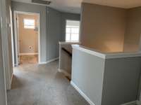 Hallway up the stairs  *COLORS AND SELECTIONS VARY, HOME PICTURED IS AN EXAMPLE OF THE FLOORPLAN NOT THE ACTUAL HOME*