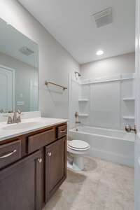 Bathroom   *Photo is of a previously built Bora Bora & another Dalamar Homes Community. Standard features & selections may vary.*