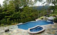 Wonderful potential for an infinity edge pool overlooking your back tree line (example photo used, but current numbers and timeline available from our original homebuilder)