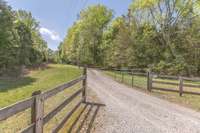 Inviting winding driveway to your little bit of Heaven