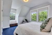 Primary bedroom upstairs with lots of natural light.