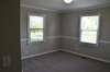 Bedroom 2 includes new carpet and chair rail.