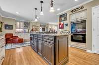 Seating area or informal dining area with wet bar off kitchen