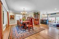 Formal dining room open to kitchen area that opens to sunroom