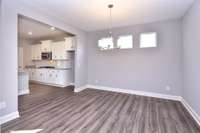 Casual Dining/Kitchen. Defined space yet very open for entertaining! Photo is not of actual home,