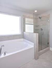 Owner's Bath Separate shower/tub. Photo not of actual home.