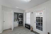 With lots of space - full size washer and dryer with room left over for a small freezer or extra storage space