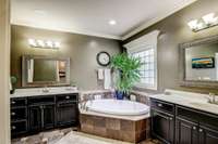 Separate double vanities and whirlpool tub!