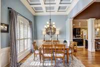 Hardwood flooring, wainscotting, coffered ceilings, plantation shutters in the dining room!