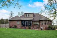 The primary suite is located on the left side of the house. The sunroom is straight ahead, the breakfast nook is the next window to the right, and the bay window located in the second bedroom on the main floor. The window upstairs is bedroom #5.