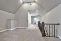 Just off the upper-level landing is a bright opening (protected by a safety railing) that looks down into the foyer. This way, residents can easily hear guests being greeted at the door.