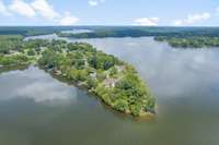 The bird’s eye view brings into perspective the panoramic nature of the home’s vantage point. The parcel commands 300° views of the water. 111 of the 119 windows have gorgeous lake views & provide excellent visibility of sunsets & sunrises.