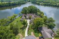 A view from above allows one to appreciate the scope of this coveted property.  With just under 1000 ft of private shoreline on the lake and deep-water dock, already installed, allows you to enjoy the water activities afforded by lake living.