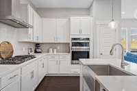 White cabinets, light quartz counters...GREAT OPEN Space