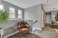 As you go upstairs, you have a reading nook corner.