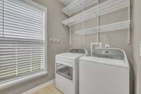 Laundry Room with Elfa storage systems installed for extra storage
