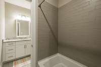 Jack and Jill Bathroom with Separate Vanities for each Bedroom upstairs.