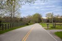 Looking west on Tom Anderson Rd from the driveway