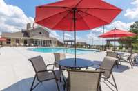 These tables, chairs umbrellas are the perfect place to hang out during a hot summer day.