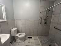 Hall bath with tile shower