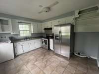 Kitchen complete with stove and fridge